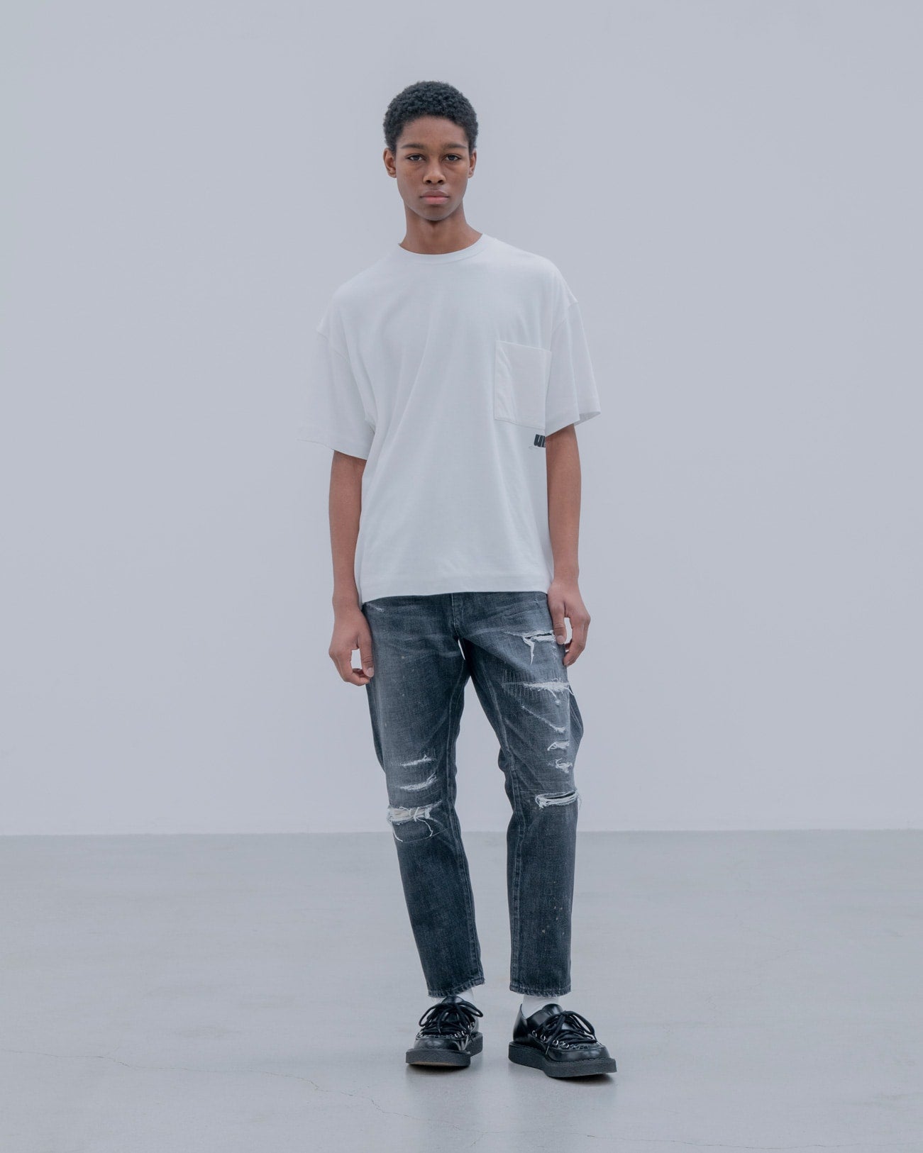 DAMAGED DENIM TAPERED-FIT JEANS