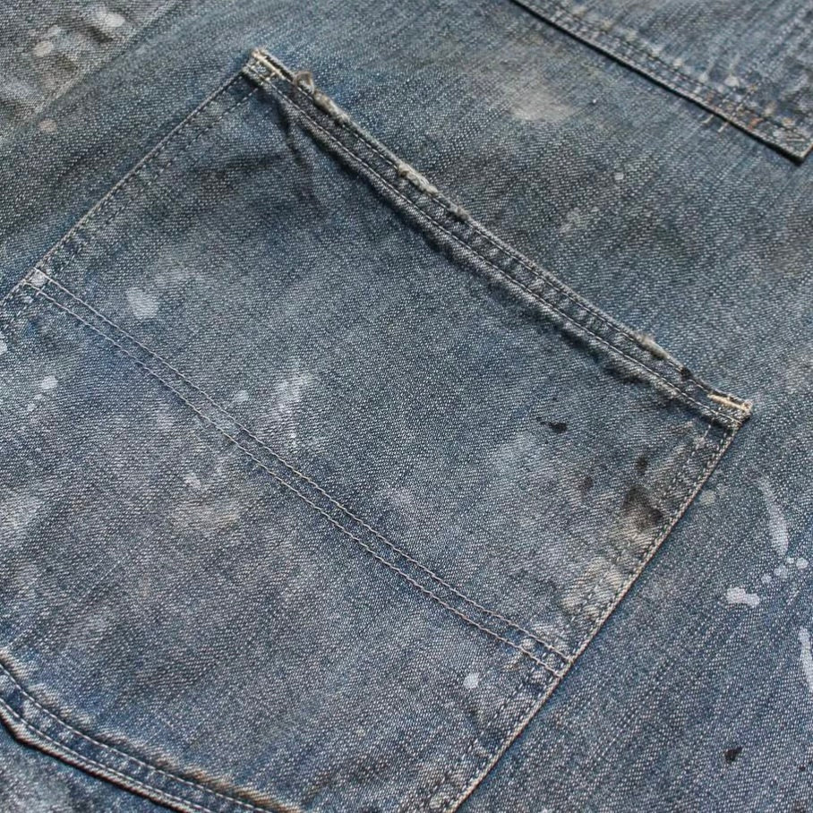 PAINT-STAINED ENGINEER'S COVERALL