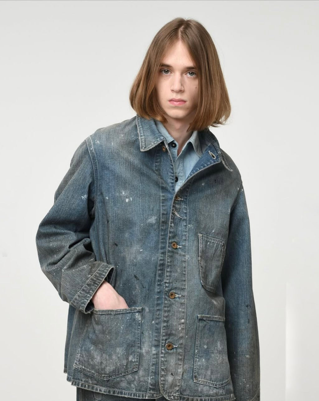PAINT-STAINED ENGINEER'S COVERALL