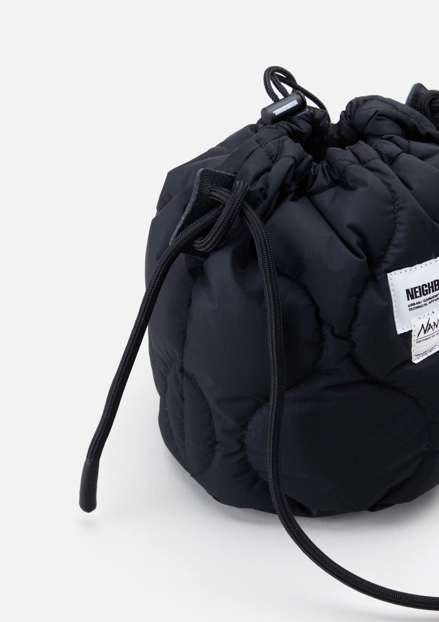 NH × NANGA. DOWN DRAWSTRING BAG