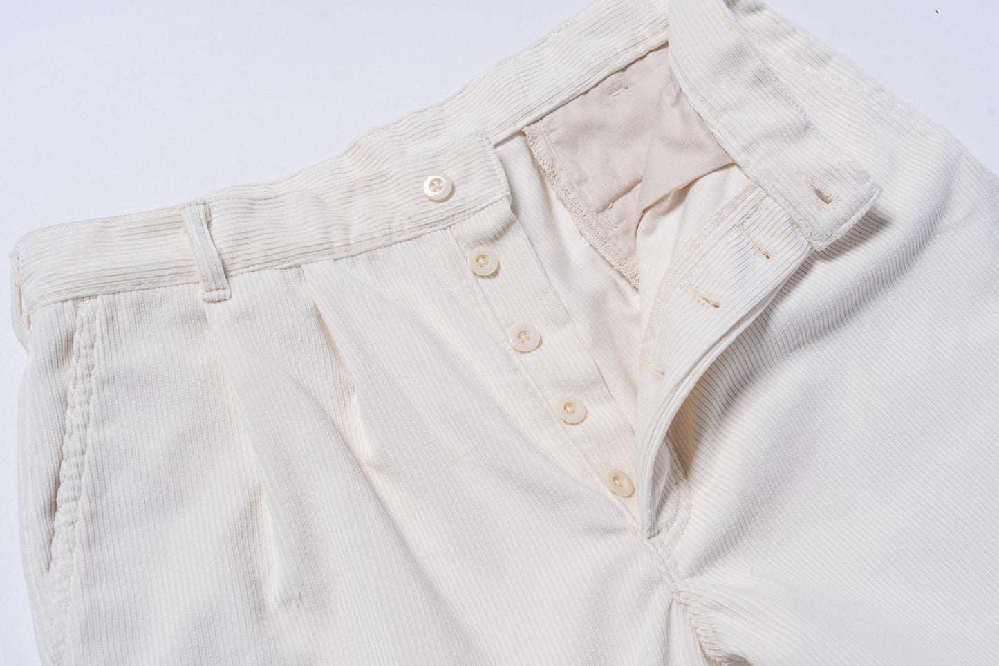 DOUBLE-PLEAT CORDUROY TROUSERS